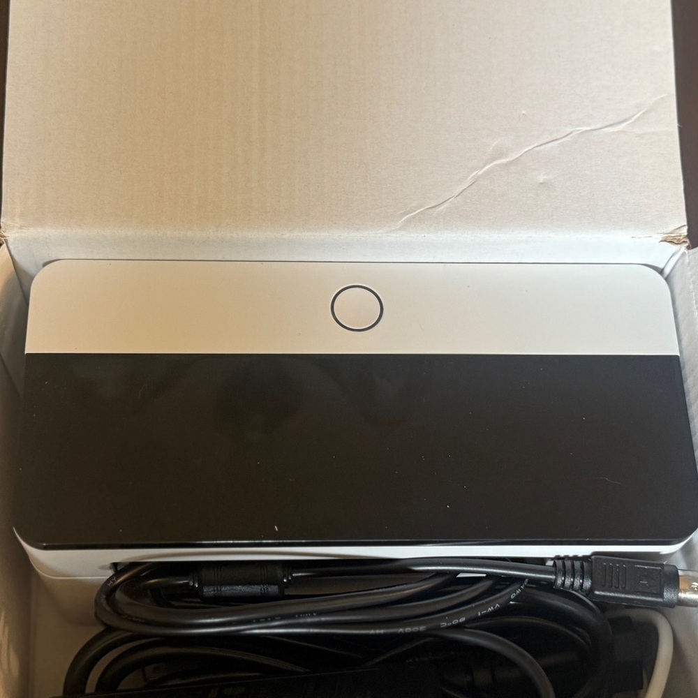 Black and White Electronic Device with Cable